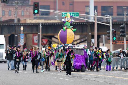 St. Louis, Missouri, USA - March 2, 2019: Bud Light Grand Parade, Women wearing colorful outfits...