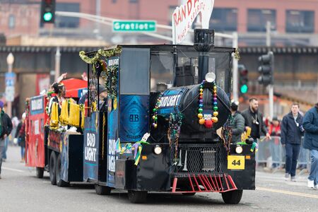 St. Louis, Missouri, USA - March 2, 2019: Bud Light Grand Parade, A street train promoting Bud Light going down 7th street during the paradeのeditorial素材