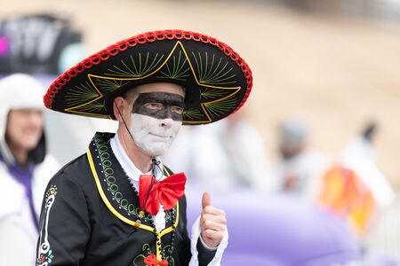 St. Louis, Missouri, USA - March 2, 2019: Bud Light Grand Parade, Man with face paint and wearing a mexican mariachi style outfitのeditorial素材