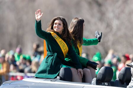 Chicago, Illinois, USA - March 16, 2019: St. Patrick's Day Parade, Beauty Queens, waving at the...
