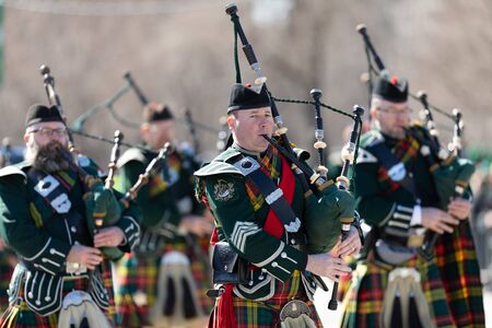 Chicago, Illinois, USA - March 16, 2019: St. Patrick's Day Parade, Bagpipe band, marching down columbus dr at the paradeのeditorial素材