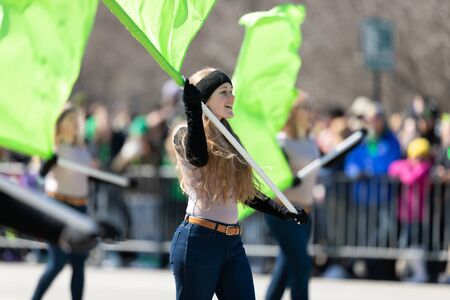 Chicago, Illinois, USA - March 16, 2019: St. Patrick's Day Parade, Members of the Central Carroll High School Marching Pride, performing at the parade, going down columbus drのeditorial素材