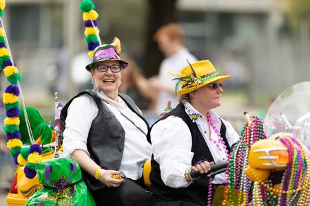 New Orleans, Louisiana, USA - February 23, 2019: Mardi Gras Parade, Women riding motorcycle at the...