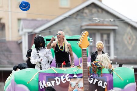 New Orleans, Louisiana, USA - February 23, 2019: Mardi Gras Parade, Dee Snider on a float throwing beads to the spectators during the mandi gras paradeのeditorial素材