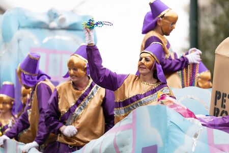 New Orleans, Louisiana, USA - February 23, 2019: Mardi Gras Parade, Woman wearing traditional...