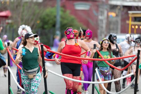 New Orleans, Louisiana, USA - February 23, 2019: Mardi Gras Parade, Members of El Lucha Krewe, Dancing at the Mardi Gras Paradeのeditorial素材