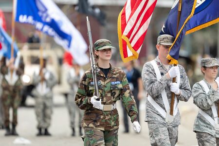 New Orleans, Louisiana, USA - February 23, 2019: Mardi Gras Parade, Members of the Civil Air Patrol marching, carrying the American Flagのeditorial素材