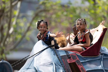Cleveland, Ohio, USA - June 8, 2019: Parade the Circle, children riding an abstract rino during the...