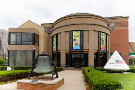 Grand Rapids , Michigan, USA - June 15, 2019: The  Andel Museum Center, Public Museum, with a space capsule and a historic bell at the entranceのeditorial素材