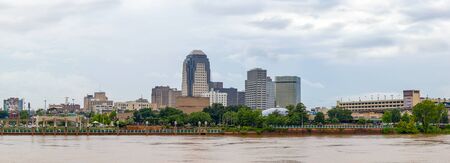 Shreveport, city in the state of Louisiana, United States, as seen across the Red River, during overcast and rainの写真素材