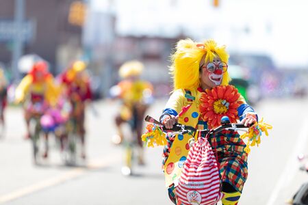 Benton Harbor, Michigan, USA - May 4, 2019: Blossomtime Festival Grand Floral Parade, Michiana Clowns riding bicycles during the paradeのeditorial素材
