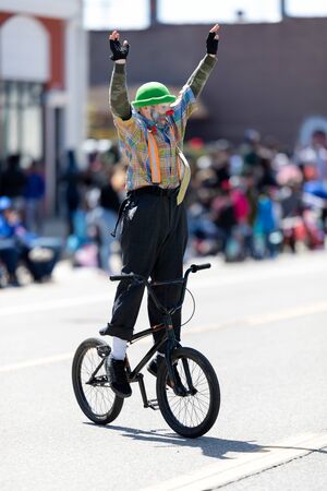 Benton Harbor, Michigan, USA - May 4, 2019: Blossomtime Festival Grand Floral Parade, Michiana Clowns riding bicycles during the paradeのeditorial素材