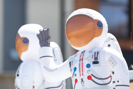Benton Harbor, Michigan, USA - May 4, 2019: Blossomtime Festival Grand Floral Parade, Float carrying two astronauts balloon during the paradeのeditorial素材