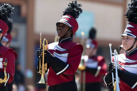 Benton Harbor, Michigan, USA - May 4, 2019: Blossomtime Festival Grand Floral Parade, Members of the Watervliet High School Marching Band performing at the paradeのeditorial素材