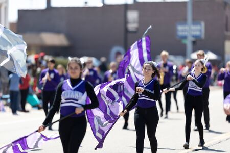 Benton Harbor, Michigan, USA - May 4, 2019: Blossomtime Festival Grand Floral Parade, Members of the Titans Michigan Lutheran Marching band performing at the paradeのeditorial素材