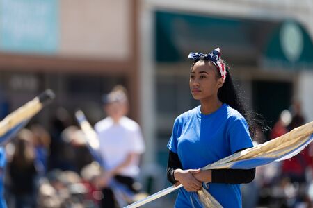 Benton Harbor, Michigan, USA - May 4, 2019: Blossomtime Festival Grand Floral Parade, Members of the Niles Vikings Marching band performing at the paradeのeditorial素材
