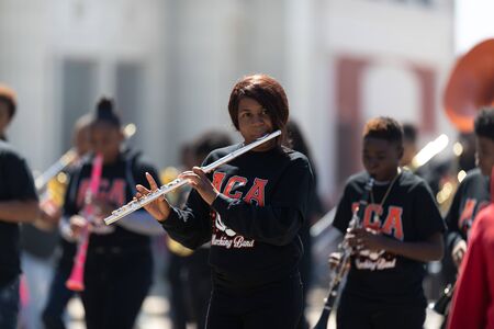 Benton Harbor, Michigan, USA - May 4, 2019: Blossomtime Festival Grand Floral Parade, Members of ACA dance team and marching band, performing at the paradeのeditorial素材