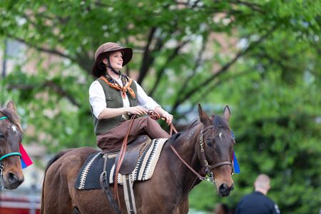 Louisville, Kentucky, USA - May 2, 2019: The Pegasus Parade, Mature woman riding a horse during the...