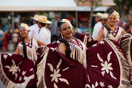 Matamoros, Tamaulipas, Mexico - June 30, 2019:  Kermes Cathedral Nuestra Senora del Refugio, Men and women in traditional clothing, performing traditional dances during a Church Festival in the streets of Matamorosのeditorial素材