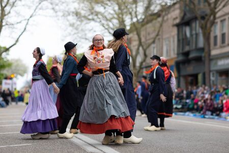 Holland, Michigan, USA - May 11, 2019: Tulip Time Festival, Young women wearing traditional Dutch...