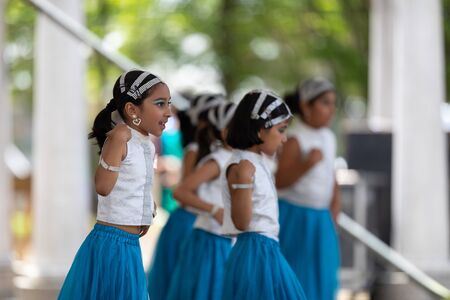 Columbus, Ohio, USA - May 26, 2019: Columbus Asian Festival, Franklin Park, Indian Girls in traditional clothing, performing traditional Indian dance at the festival.のeditorial素材