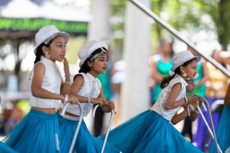 Columbus, Ohio, USA - May 26, 2019: Columbus Asian Festival, Franklin Park, Indian Girls in traditional clothing, performing traditional Indian dance at the festival.のeditorial素材