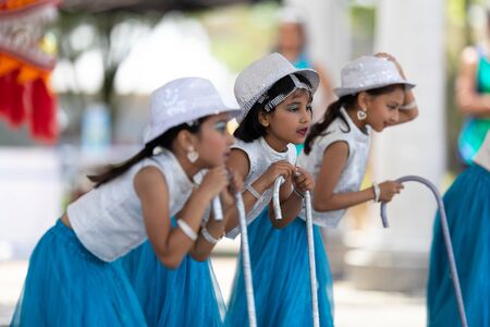 Columbus, Ohio, USA - May 26, 2019: Columbus Asian Festival, Franklin Park, Indian Girls in traditional clothing, performing traditional Indian dance at the festival.のeditorial素材
