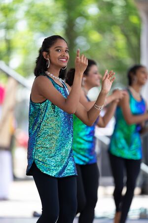 Columbus, Ohio, USA - May 26, 2019: Columbus Asian Festival, Franklin Park, Indian Women in traditional clothing, performing traditional Indian dance at the festival.のeditorial素材