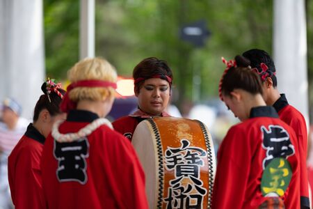 Columbus, Ohio, USA - May 26, 2019: Columbus Asian Festival, Members of Takarabune dance group from Japan, wearing traditional clothing performing traditional dances at the Amphitheater in the Franklin Park.のeditorial素材