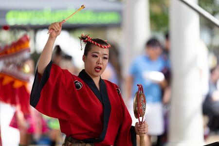 Columbus, Ohio, USA - May 26, 2019: Columbus Asian Festival, Members of Takarabune dance group from Japan, wearing traditional clothing performing traditional dances at the Amphitheater in the Franklin Park.のeditorial素材