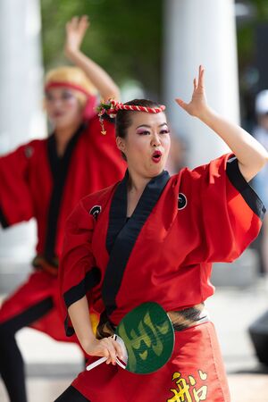 Columbus, Ohio, USA - May 26, 2019: Columbus Asian Festival, Members of Takarabune dance group from Japan, wearing traditional clothing performing traditional dances at the Amphitheater in the Franklin Park.のeditorial素材