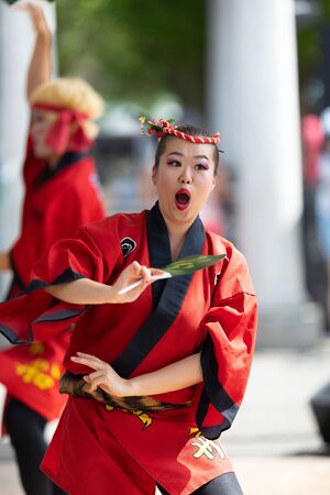 Columbus, Ohio, USA - May 26, 2019: Columbus Asian Festival, Members of Takarabune dance group from Japan, wearing traditional clothing performing traditional dances at the Amphitheater in the Franklin Park.のeditorial素材