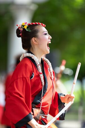 Columbus, Ohio, USA - May 26, 2019: Columbus Asian Festival, Members of Takarabune dance group from Japan, wearing traditional clothing performing traditional dances at the Amphitheater in the Franklin Park.のeditorial素材