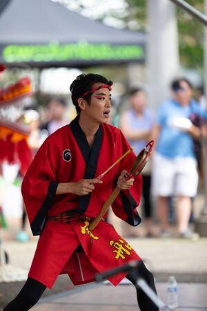 Columbus, Ohio, USA - May 26, 2019: Columbus Asian Festival, Members of Takarabune dance group from Japan, wearing traditional clothing performing traditional dances at the Amphitheater in the Franklin Park.のeditorial素材