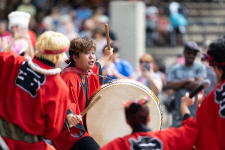 Columbus, Ohio, USA - May 26, 2019: Columbus Asian Festival, Members of Takarabune dance group from Japan, wearing traditional clothing performing traditional dances at the Amphitheater in the Franklin Park.のeditorial素材