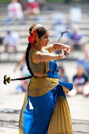 Columbus, Ohio, USA - May 26, 2019: Columbus Asian Festival, Franklin Park, Indian women in traditional clothing, performing traditional Indian dance.のeditorial素材