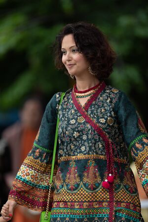 Grand Rapids, Michigan, USA - June 15, 2019: Asian Pacific Festival, Pakistani woman wearing traditional clothing at a fashion display  in the Rosa Parks Circleのeditorial素材
