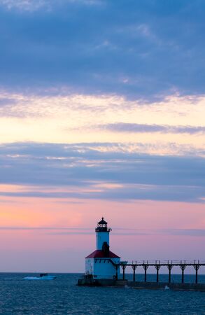 The Michigan City Breakwater Lighthouse, in the State of Indiana USA, as seen at Sunsetの写真素材