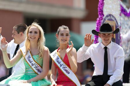 Buckhannon, West Virginia, USA - May 18, 2019: Strawberry Festival, Beauty Contestants, on float, going down Main Street, smiling, waving at spectators, during the paradeのeditorial素材