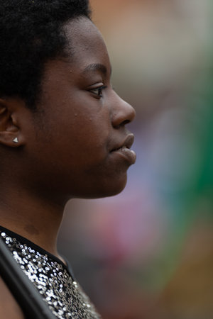 Holland, Michigan, USA - May 11, 2019: Tulip Time Parade, Close up of the profile of a young african american cheerleader during the paradeのeditorial素材