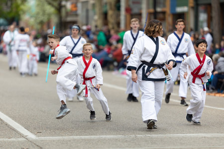Holland, Michigan, USA - May 11, 2019: Tulip Time Parade, Display by school of martial arts on the street during the paradeのeditorial素材