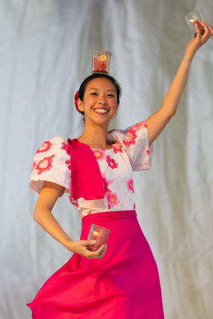 St. Louis, Missouri, USA - August 24, 2019: Festival of Nations, Tower Grove Park, Members of the Philippine Art Foundation, wearing traditional clothing, performing traditional Filipino dancesのeditorial素材