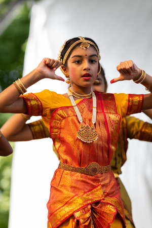 St. Louis, Missouri, USA - August 24, 2019: Festival of Nations, Tower Grove Park, Members of the Soorya Performing Arts, wearing traditional clothing, performing traditional dances from Indiaのeditorial素材