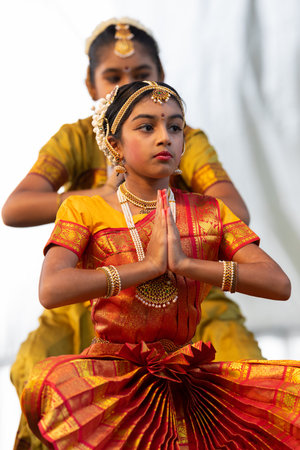 St. Louis, Missouri, USA - August 24, 2019: Festival of Nations, Tower Grove Park, Members of the Soorya Performing Arts, wearing traditional clothing, performing traditional dances from Indiaのeditorial素材