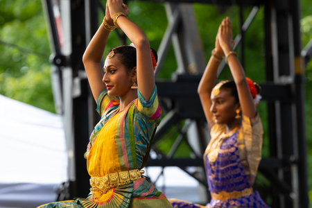 St. Louis, Missouri, USA - August 24, 2019: Festival of Nations, Tower Grove Park, Members of the Soorya Performing Arts, wearing traditional clothing, performing traditional dances from Indiaのeditorial素材
