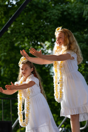 St. Louis, Missouri, USA - August 24, 2019: Festival of Nations, Tower Grove Park, Members of the Hui Hula O Punahele Hula Halau, wearing traditional clothing, performing traditional Polynesian dancesのeditorial素材