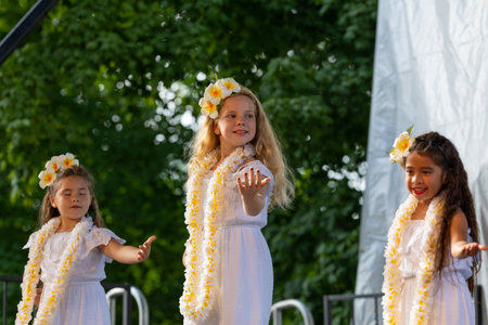St. Louis, Missouri, USA - August 24, 2019: Festival of Nations, Tower Grove Park, Members of the Hui Hula O Punahele Hula Halau, wearing traditional clothing, performing traditional Polynesian dancesのeditorial素材