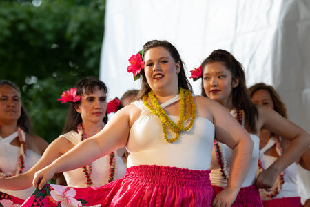 St. Louis, Missouri, USA - August 24, 2019: Festival of Nations, Tower Grove Park, Members of the Hui Hula O Punahele Hula Halau, wearing traditional clothing, performing traditional Polynesian dancesのeditorial素材