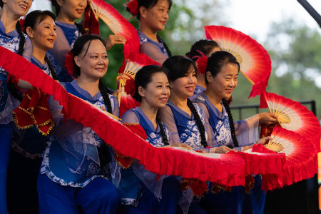 St. Louis, Missouri, USA - August 25, 2019: Festival of Nations, Tower Grove Park, Members of the St. Louis Modern Chinese School, wearing traditional clothing, performing traditional dances from Chinaのeditorial素材