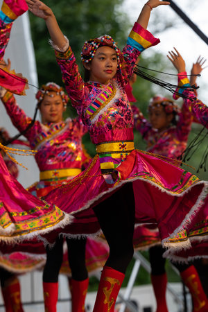 St. Louis, Missouri, USA - August 25, 2019: Festival of Nations, Tower Grove Park, Members of the St. Louis Modern Chinese School, wearing traditional clothing, performing traditional dances from Chinaのeditorial素材